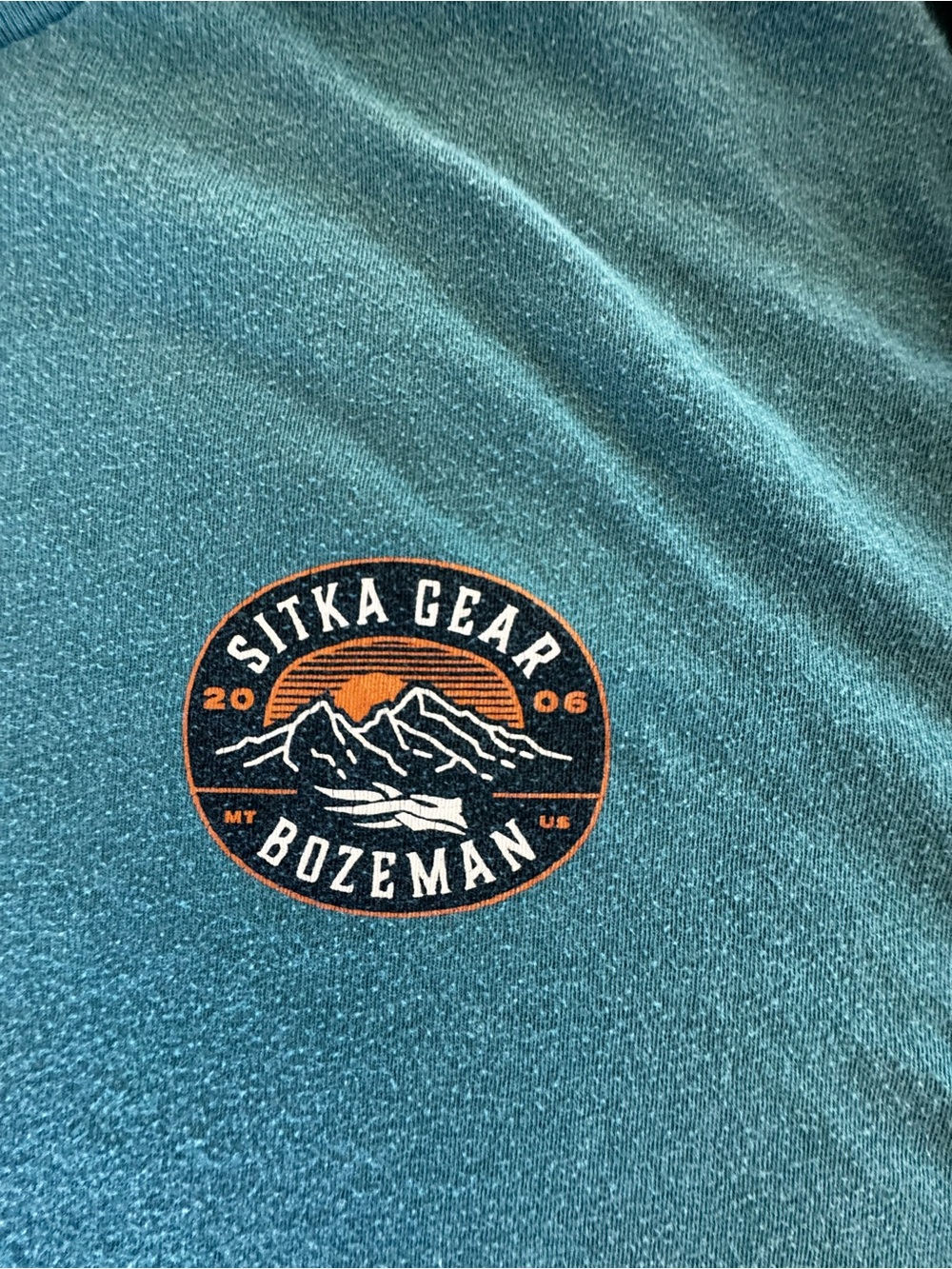 Sitka Bozeman Men’s Tee - Teal with Orange Logo